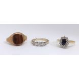 A 9ct hardstone signet ring, an 18ct cluster ring and small 9ct diamond three stone ring (3).