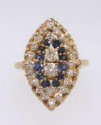 An 18ct yellow gold sapphire and diamond oval shape ring, the setting approx 23mm x 14mm.