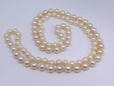 A single row of graduating sea water cultured pearls, together with a copy of a detailed insurance