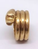 A 22ct yellow gold 'snake' ring, approx 12.60 gms.