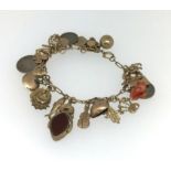 A 9ct gold mixed charm bracelet, approx 40.3gms.