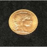 France, a gold 1909 twenty francs, approx 6.5gms.