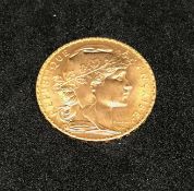 France, a gold 1909 twenty francs, approx 6.5gms.