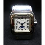 Cartier, Santos, a ladies gold and stainless steel wristwatch, with moon phase & date, the square