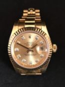 Rolex, a fine ladies 18ct gold Datejust Chronometer wristwatch with champagne diamond dot dial,