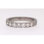 A platinum half band eternity and diamond set ring, ring size N.
