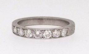 A platinum half band eternity and diamond set ring, ring size N.