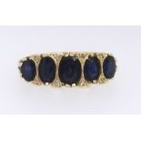 An 18ct sapphire and diamond five stone ring, ring size O.