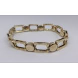 A 9ct gold open rectangular and drum shaped bracelet approx 21.86gms, together with a copy of a