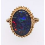 An 9ct opal oval cut ring, ring size O.