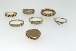 Five various gold dress rings comprising two 18ct (5.5gms) and four 9ct including a locket (12.