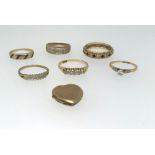 Five various gold dress rings comprising two 18ct (5.5gms) and four 9ct including a locket (12.