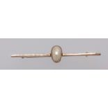 A 9ct bar brooch set with a single pearl.