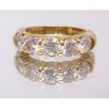 A good 18ct yellow gold diamond five stone ring, ring size M.