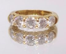 A good 18ct yellow gold diamond five stone ring, ring size M.
