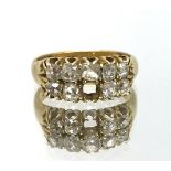 An 18ct diamond nine stone diamond ring (one stone missing), ring size K, approx 5.9gms.