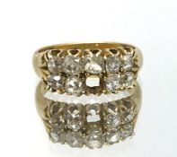 An 18ct diamond nine stone diamond ring (one stone missing), ring size K, approx 5.9gms.