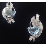 A pair of art deco style aqua marine and diamond stylish earrings set in 14k white gold.