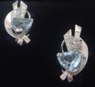 A pair of art deco style aqua marine and diamond stylish earrings set in 14k white gold.