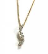 A 9ct pendant and chain, the wavy line pendant set with brilliant cut diamonds, together with a copy