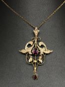 An Art Nouveau style 9ct amethyst and seed pearl pendant.