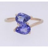 A modern tanzanite dress ring set in yellow gold, stamped 10k, ring size O.