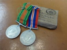 Two WWII medals awarded to W.J. Hancock with box and ribbons