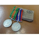 Two WWII medals awarded to W.J. Hancock with box and ribbons