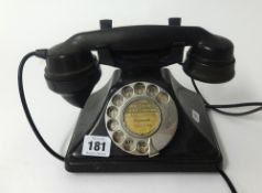 A vintage black bakelite telephone