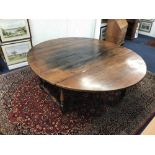 A large and heavy joined oak gate leg dining table, commissioned and made by Martin Bednarchuk, a