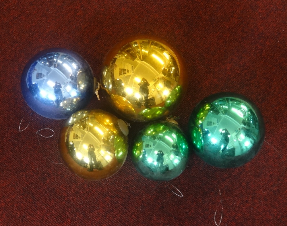 Five coloured glass 'Witches' balls.