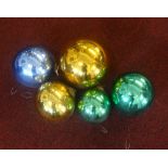 Five coloured glass 'Witches' balls.