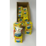 A collection of small Smurf novelty egg cups and cosies, boxed (14).