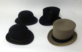 Two bowler hats and one top hat in Harrods boxes together with another top hat (4).