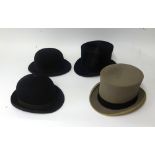 Two bowler hats and one top hat in Harrods boxes together with another top hat (4).