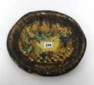 A heavy glazed plaque 'The Last Supper', diameter 30cm.