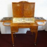 A fine quality English satinwood dressing table of George III style, With a folding lid enclosing