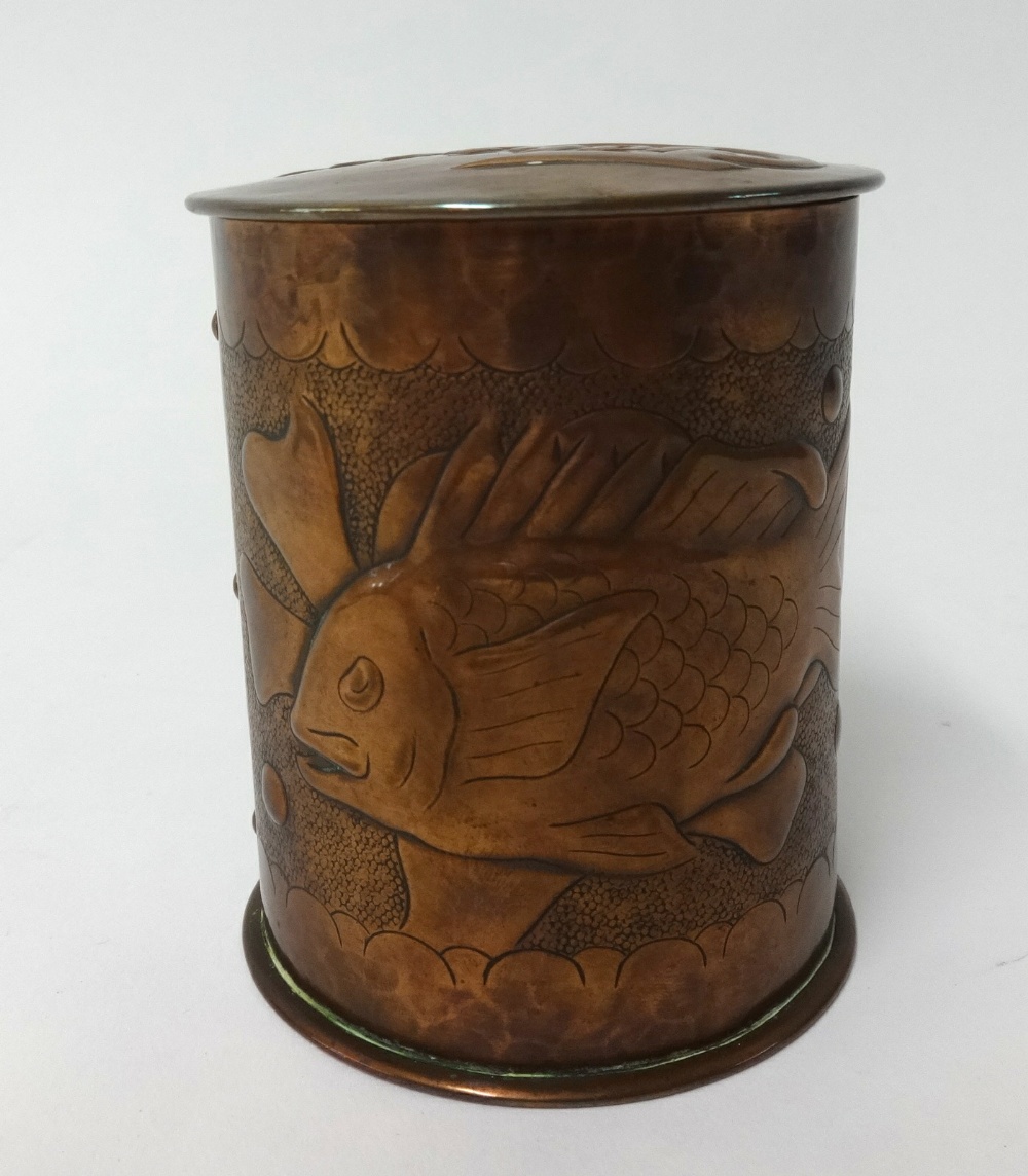 Newlyn, a copper circular tobacco jar, relief decorated with a fish, impressed 'Newlyn', height