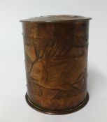 Newlyn, a copper circular tobacco jar, relief decorated with a fish, impressed 'Newlyn', height