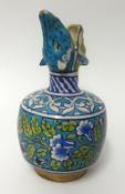 An antique Iznik pottery jug, height 23cm.