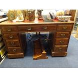 An oak pedestal desk