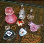 A porcelain scent bottle with silver cap and glass scent bottles etc.