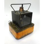A Railway portable Oil Lamp, black, square copper base, embossed as follows on side of copper