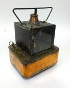 A Railway portable Oil Lamp, black, square copper base, embossed as follows on side of copper