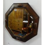 A 1930's oak framed octagonal wall mirror.