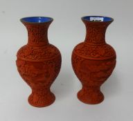 A pair of 20th Century cinnabar style vases, height 20cm.