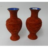 A pair of 20th Century cinnabar style vases, height 20cm.