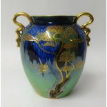 Carlton Ware, a lustre art pottery twin handled vase decorated with stylised birds and trees, height