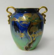 Carlton Ware, a lustre art pottery twin handled vase decorated with stylised birds and trees, height