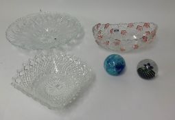 Three 20th Century moulded glass tableware's, a Caithness 'High Seas' paperweight and another.